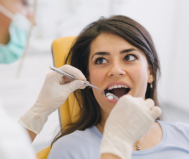 Dentist performing a wisdom tooth extraction