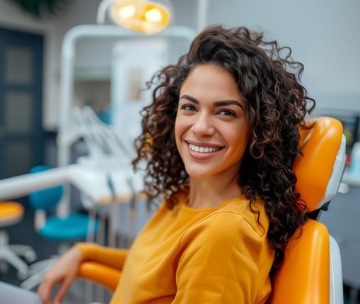 Happy dental patient in treatment chair