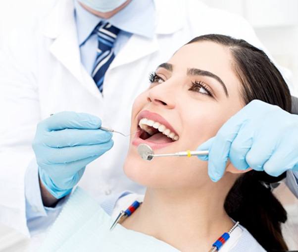 smiling after getting tooth-colored filling in Carrollton