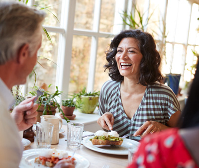 People converse over brunch