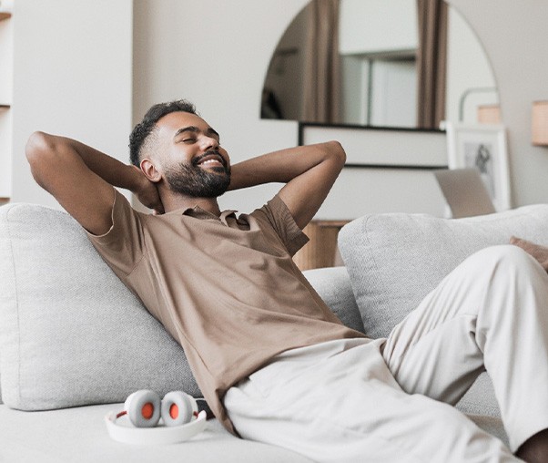 a man relaxing on a couch