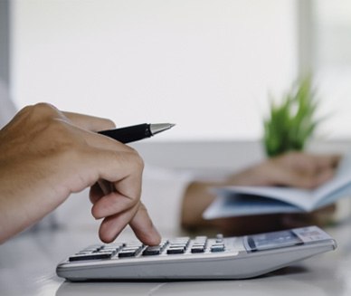 Man using a calculator