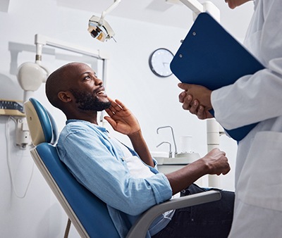 Man smiling at the dentist