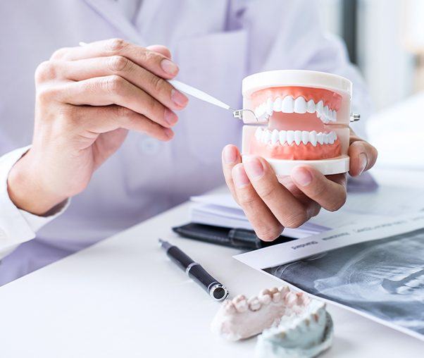 Dentist showing patient a smile model during treatment planning