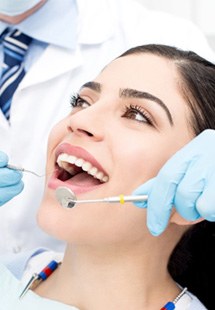 patient smiling while visiting dentist 