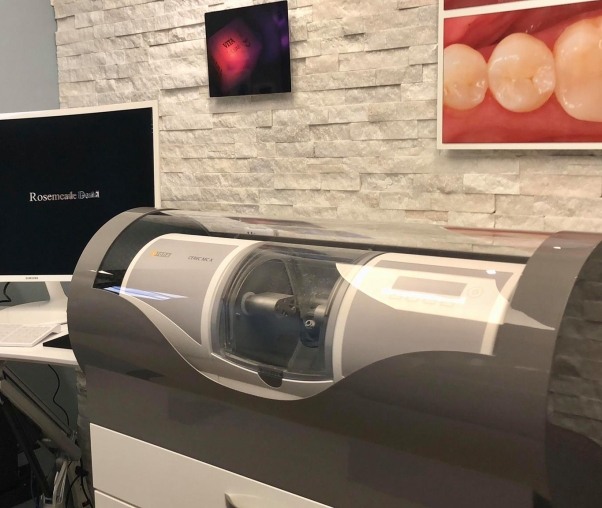 Machine crafting a same day dental crown in Carrollton dental office
