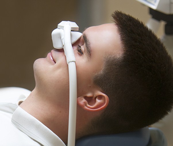 Man with nitrous oxide dental sedation mask
