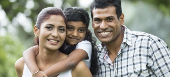 Parents and child smiling after children's dentistry visit