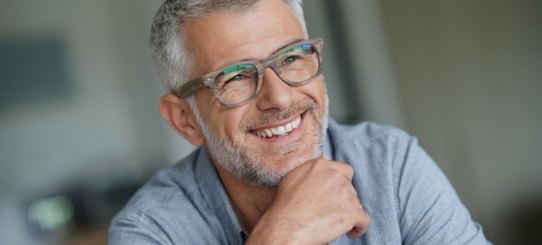 Man smiling after periodontal therapy