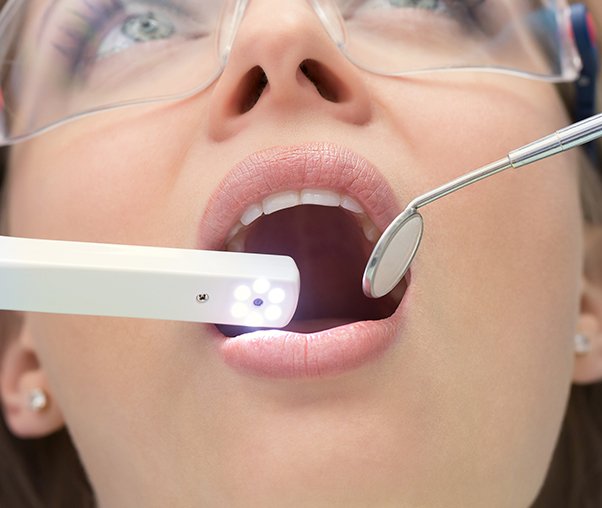 Dentist capturing images with intraoral camera