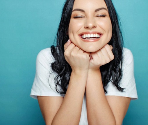 young woman showing off her pearly whites