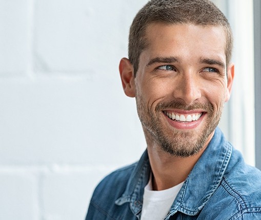 patient smiling after getting veneers in Carollton