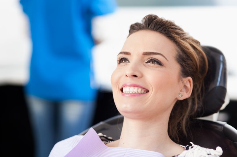 Woman sitting in dentist chair