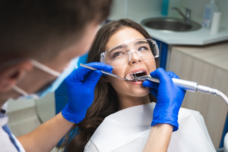 A patient receiving a root canal retreatment