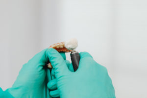 Dental lab working an a denture