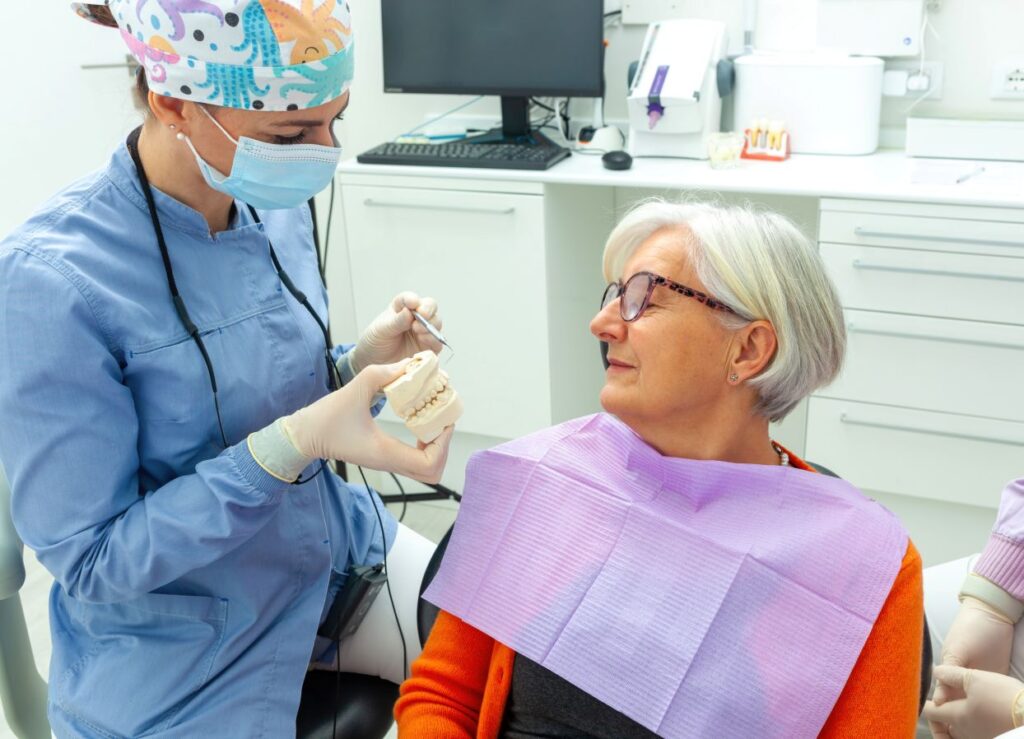 A woman discussing dental implants with her dentist